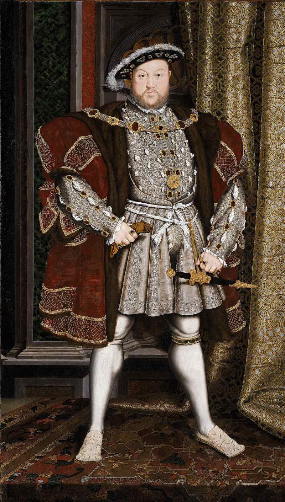 Ritratto di Enrico VIII: spalle larghe, barba e abiti sfarzosi coperti di gioielli